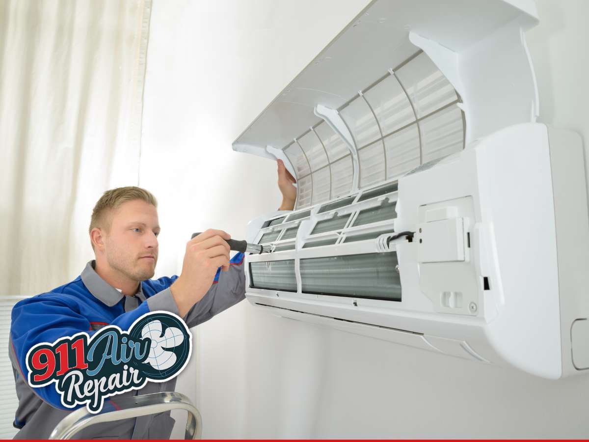 Technician servicing an air conditioner unit to ensure optimal performance. 