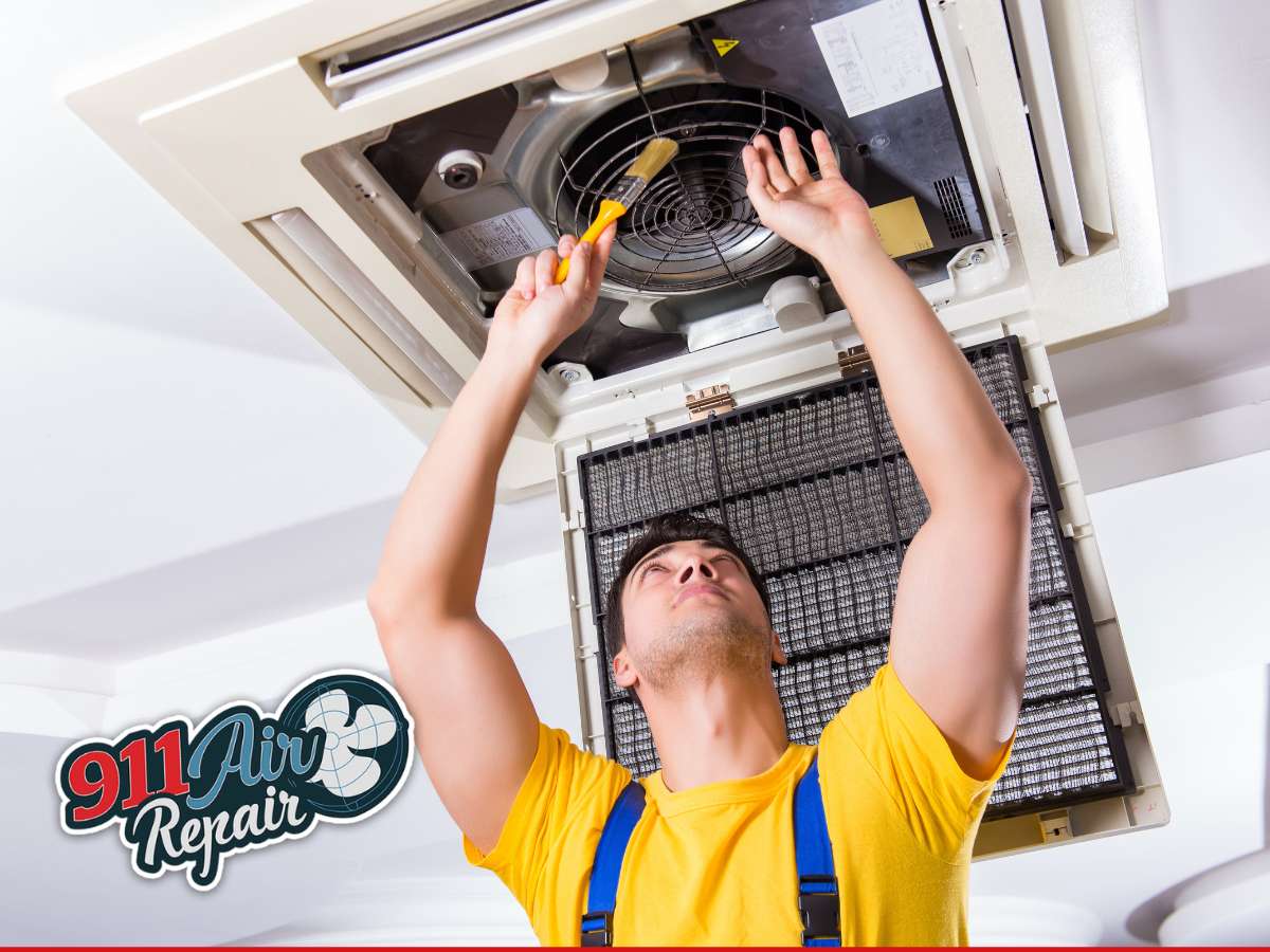 Technician inspecting AC unit to prevent AC capacitor failure